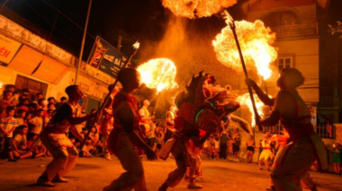 Photo: Unique lion dance, blowing fire like a circus performer on the Mid-Autumn Festival night by young people in the suburbs of Hanoi
