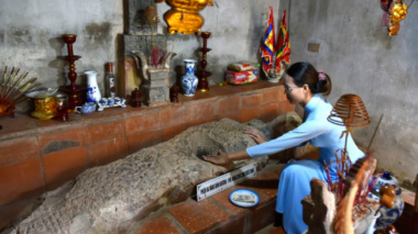 The sacred temple worships the stone slab with the image of a human head